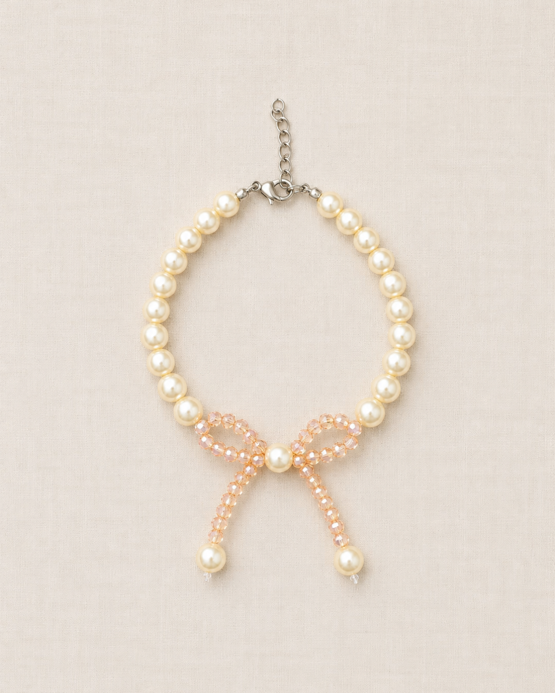 Pulseira Laço e Pérolas Champagne